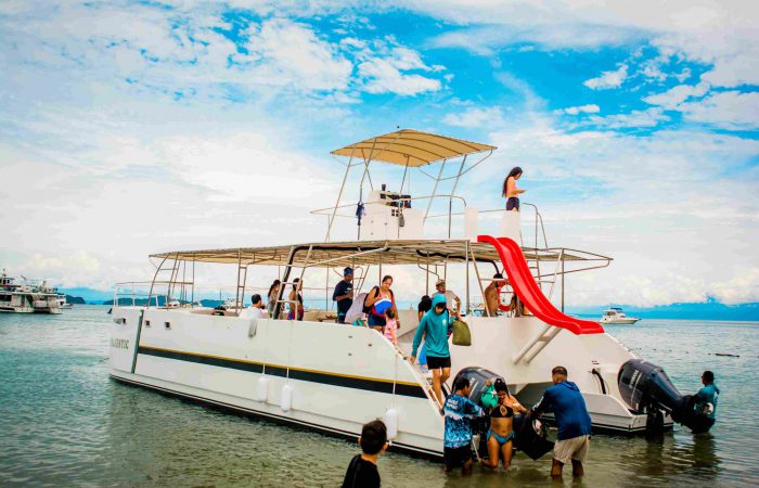 Private catamaran in Tortuga Island sailing in clear waters