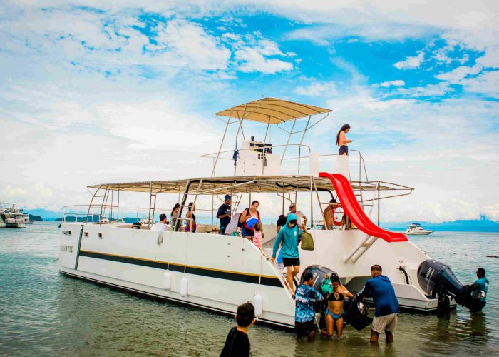 Private catamaran in Tortuga Island sailing in clear waters